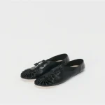 Front profile of Hender Scheme Dumple Leather Slip-On Shoes in black leather
