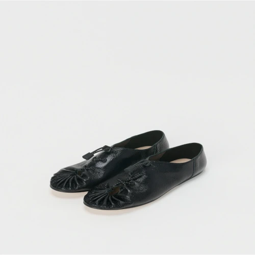 Front profile of Hender Scheme Dumple Leather Slip-On Shoes in black leather