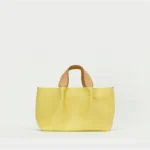 Hender Scheme medium yellow piano bag front view with premium leather construction