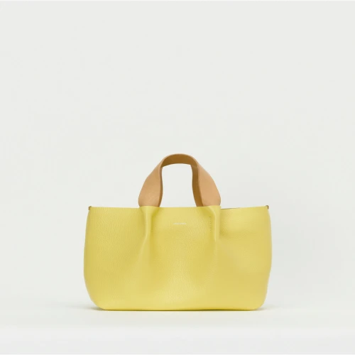 Hender Scheme medium yellow piano bag front view with premium leather construction
